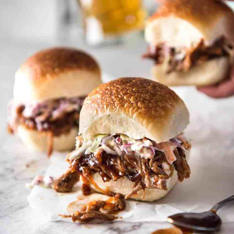 Slow Cooker BBQ Pulled Pork Sandwich - Perfectly seasoned, tender pulled pork tossed in a homemade BBQ sauce, piled onto bread with coleslaw. Slow cooker, pressure cooker or oven. recipetineats.com