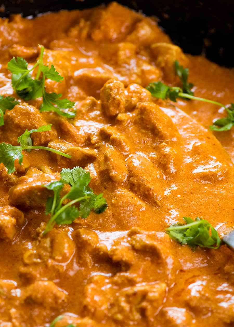 Close up of Butter Chicken in a skillet, fresh off the stove
