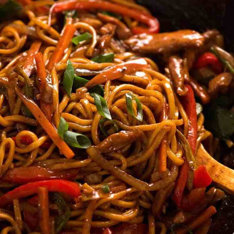 Close up of Lo Mein in a wok, ready to be served