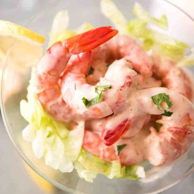 Prawn Cocktails - juicy prawns dressed with Cocktail Sauce on a bed of lettuce served in a martini glass. Elegant appetizer