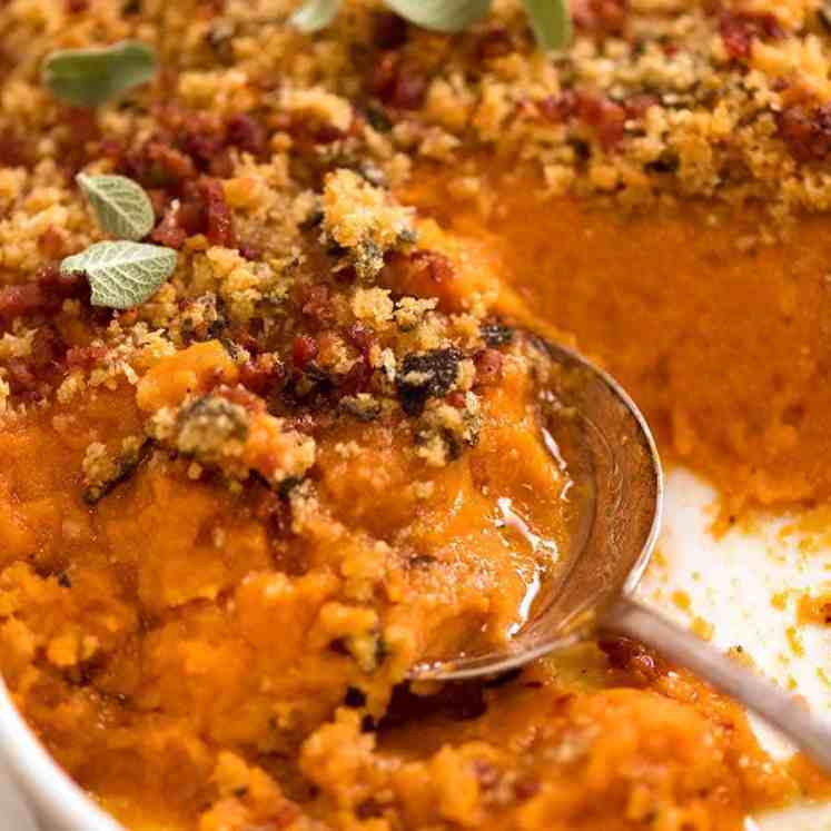 Close up of spoon serving Browned Butter Sweet Potato Casserole